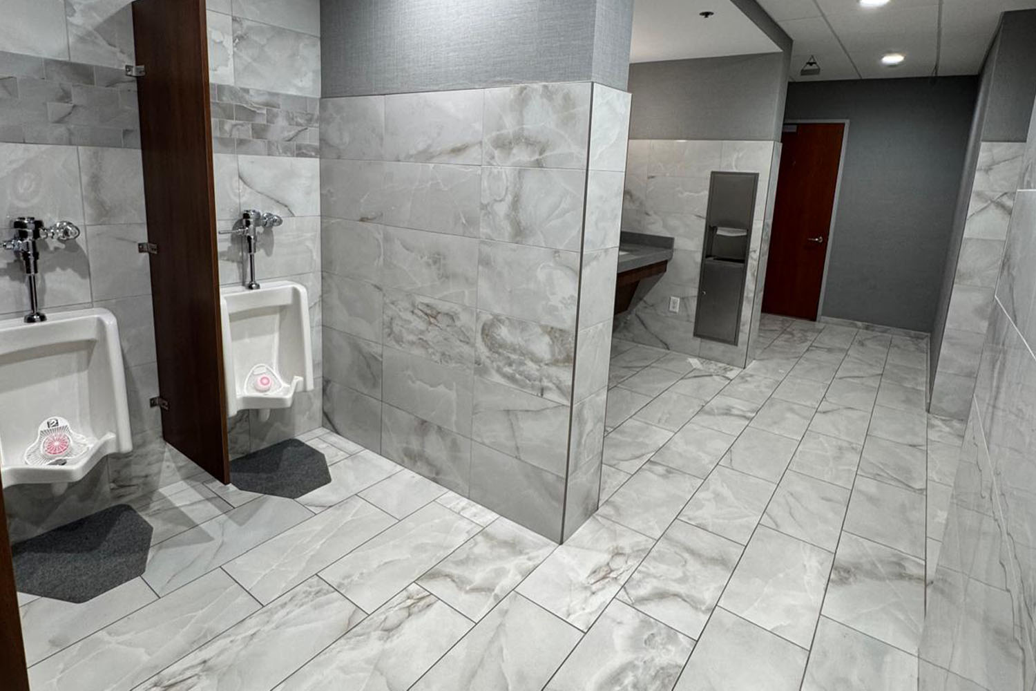 People at a concert facing the stage with various colours of paint powder in the air