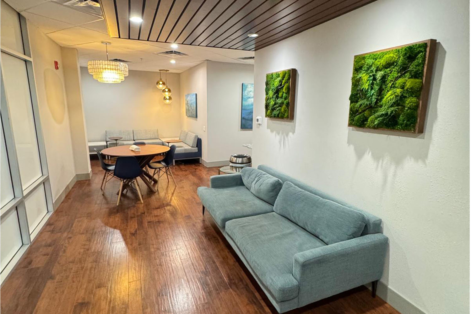 DJ facing a crowd at his deck. Photo with a purple hue